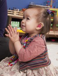 Little Girl Wearing a Hearing Aid