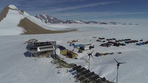 Photo 3: The Princess Elisabeth Antarctic Research Station is conveniently situated next to coastal margin mountains in East Antarctica. Credit: Dr Kate Winter, drone footage