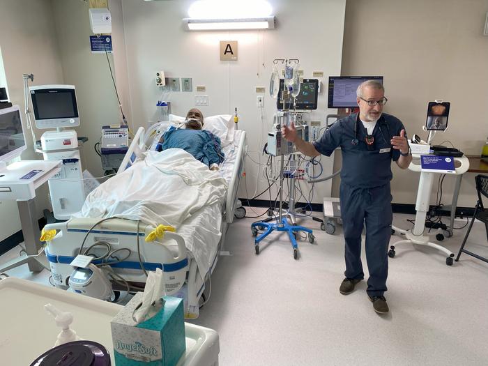 Jason Persoff, MD, SFHM, demonstrates a mockup of a Level 2 intensive care unit built inside a series of guest rooms at the Hyatt Regency Aurora-Denver Conference Center on July 22, 2025.