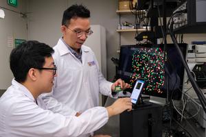 NTU Assoc Prof Y.C. Chen (right) in discussion with PhD student Fu Bowen