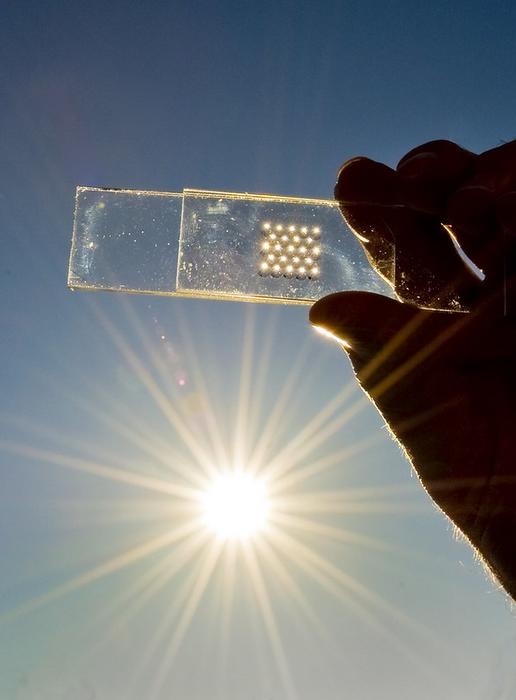 Innovative microprism sheet for semitransparent thin-film photovoltaics