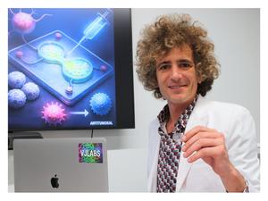 Dr. Vadim Jucaud with the Lymph Node–on-a-Chip Platform