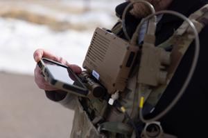 An Idaho National Laboratory expert demonstrates the use of a WSComm device.