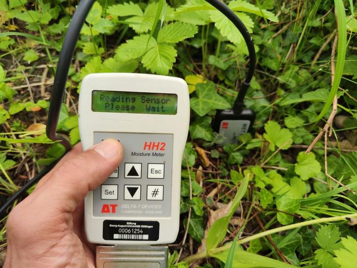 Handheld device for measuring soil moisture levels in the field.