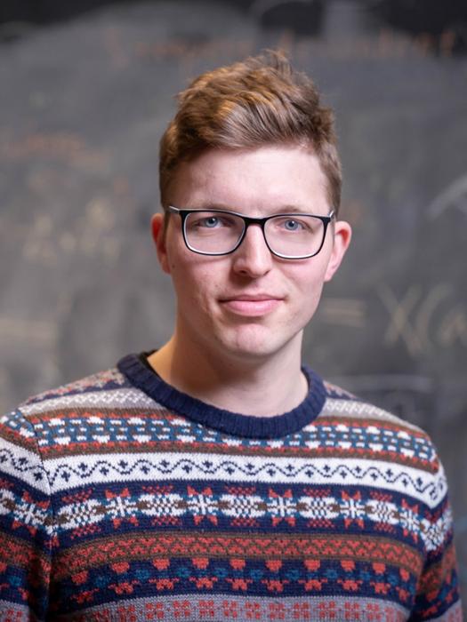 On-demand electronic switching of topology in a single crystal