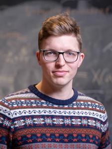 On-demand electronic switching of topology in a single crystal