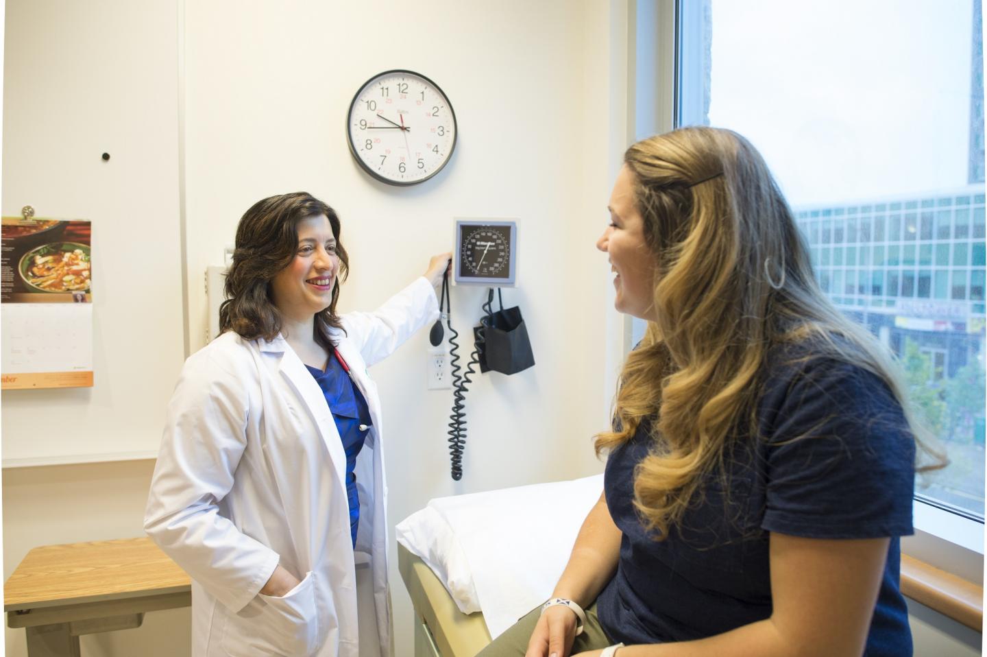 Dr. Andrea Haqq with Patient
