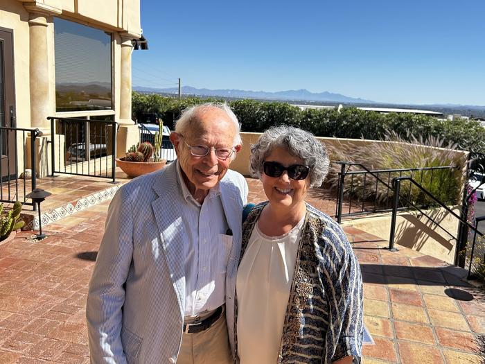 Drs. Seymour Reichlin and Esther Sternberg outside Vivace’s Restaurant, overlooking Tucson, Arizona, USA skyline. April 2024.