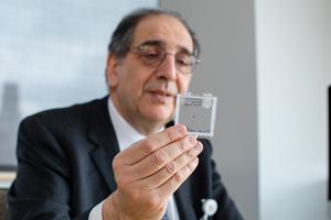 José-Alain Sahel, M.D., holding the PRIMA implant