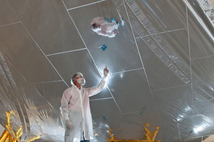 Cleanroom Engineer Surveys Sunshield for Webb