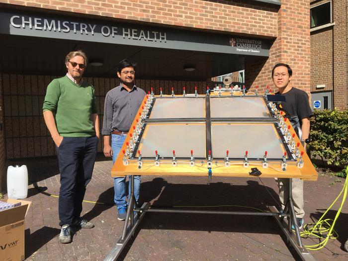 Reisner and team with the solar-powered reactor that can convert plastic waste into clean hydrogen fuel