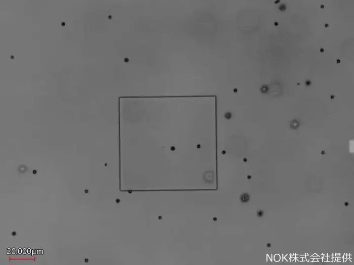 Video of beads passing through a pore