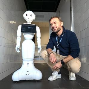 Konrad Maj (Ph.D.), social psychologist, SWPS University and robot Pepper