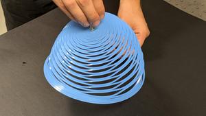 A closed-loop kirigami pattern allows a plastic sheet to adopt the shape of an inverted bell