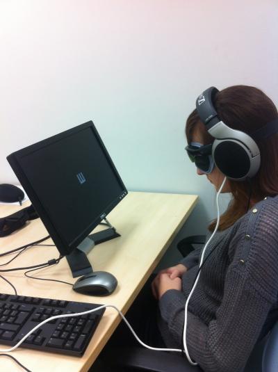 Participant Wearing Camera Glasses and Listening to the Soundscape