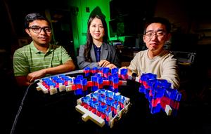 Illinois Professor Shelly Zhang, center, with fellow researchers Rahul Dev Kundu, left, and Shi Zhao, right.