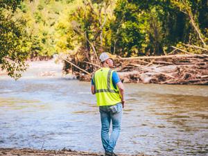 Dr. Andrew Joyner surveys damage after Hurricane Helene.