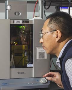 ORNL's Yongtao Liu up close with lab equipment