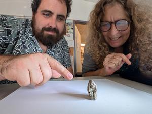 Prof. Leore Grosman and Dr. Laurent Davin with the figurine