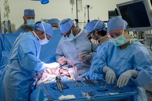 Inderbir Gill, MD (L) and Nima Nassiri, MD (C) perform the world’s first-in-human bladder transplant.
