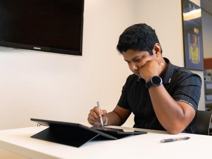 Student employing facial touching gesture