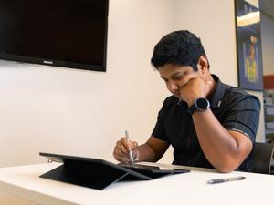 Student employing facial touching gesture