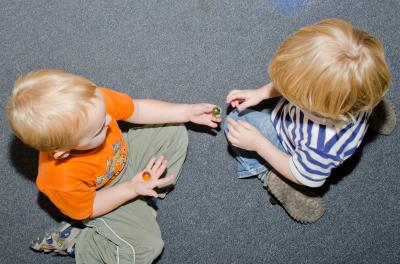 Young Children Sharing Toy