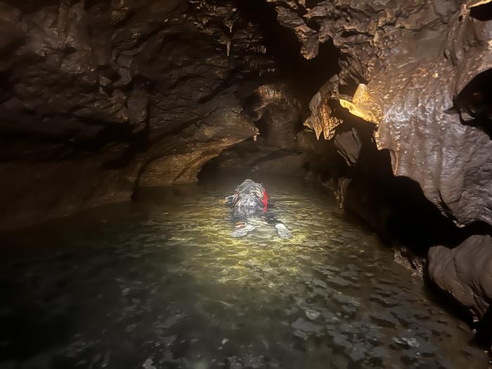 John Moretti snorkeling in water cave