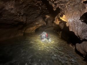 John Moretti snorkeling in water cave