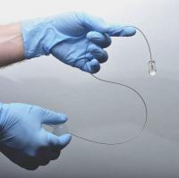 Tethered Capsule Endomicroscopy
