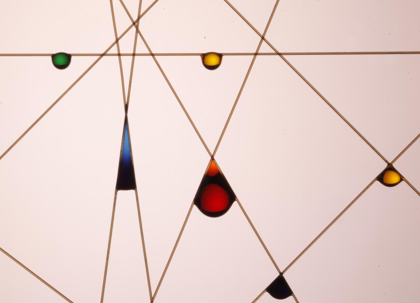 Drop on a Bent Fiber
