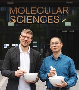 Dr Dominik Kubicki (left) and Dr Erli Lu in front of the University of Birmingham’s new Molecular Sciences Building, where the research was carried out.