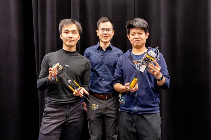 Researchers demonstrating two different versions of the ‘Hopcopter’