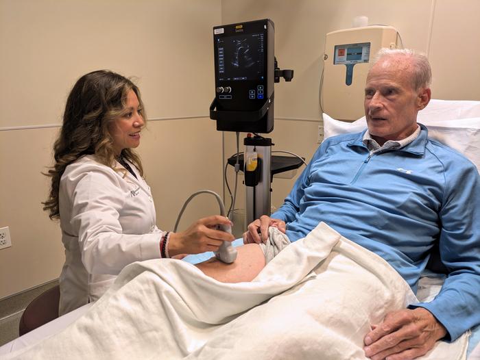 Susana Miranda, a certified nurse practitioner at Northwestern Medicine, performs an ultrasound scan of Steven McGowan’s thigh to assess his muscle density
