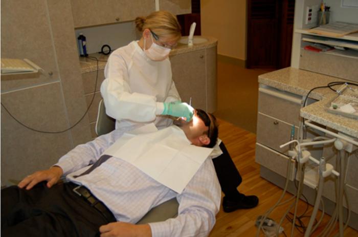 Dentist Examining a Patient During Routine Care