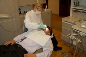 Dentist Examining a Patient During Routine Care