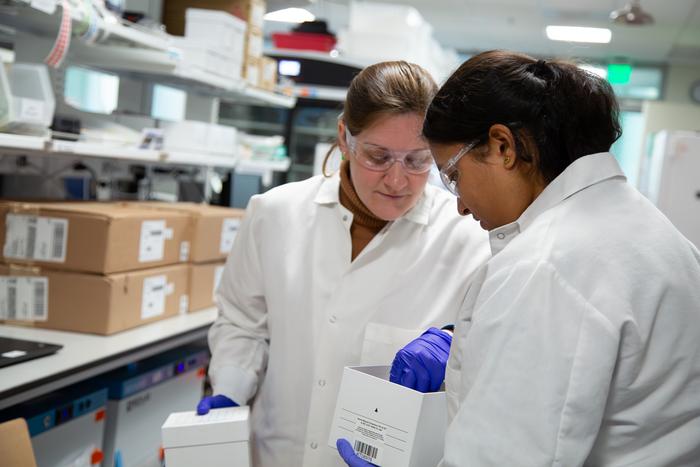 Scientists preparing research samples in the lab at Allen Institute.