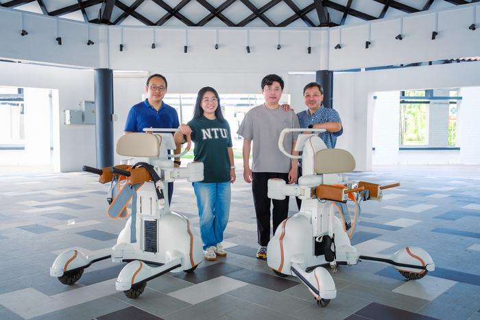 NTU Robotics Research Centre Director Assoc Prof Ang Wei Tech and his research associates with the DRBA robots.