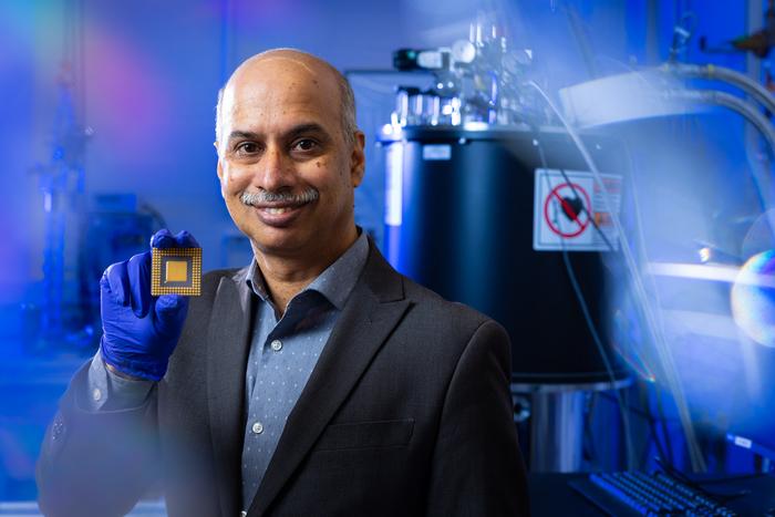 Sambandamurthy Ganapathy holds computer chip