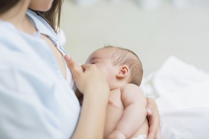 A mother breastfeeding her newborn.