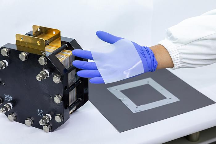 The research team demonstrates the completed BNNF-added gasket composite.