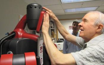 A Man Interacts with a Robot
