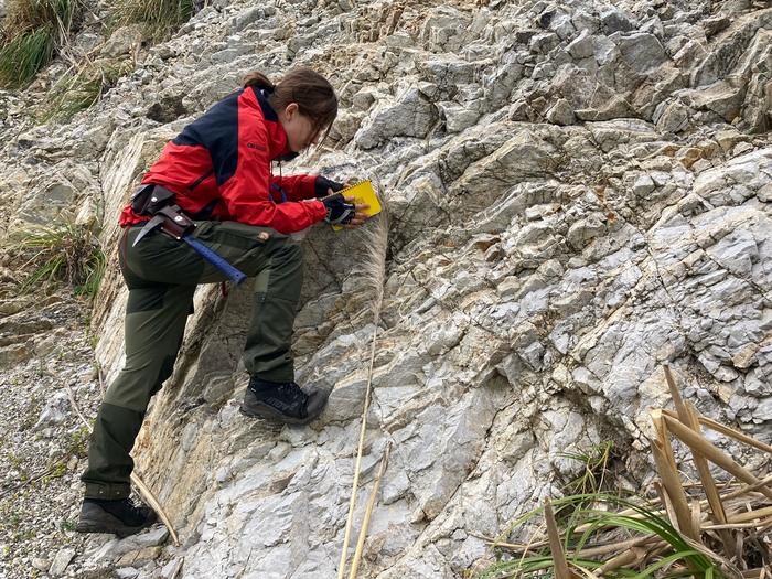 Stacey Edmonsond, UVic PhD candidate, examines a California rock outcrop
