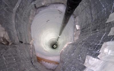 A Sensor Descends Down a Hole in the Ice