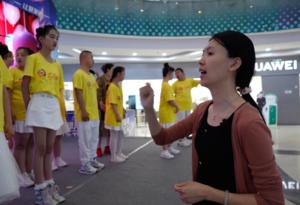 Wang instructs the children.