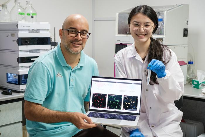 NTU Prof Ali Miserez (left) and PhD student Chen Zilin, holding the microdroplets in a test tube, which showed that it can reduce tumour growth by 67 per cent in small animal experiments.