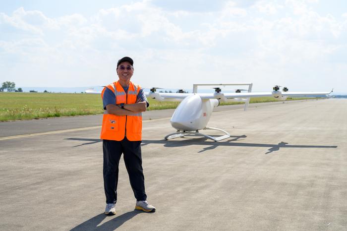 NTU Prof James Wang, Director, eVTOL Research and Innovation Centre, with the 8-metre prototype at DLR.