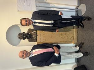 Professor Siegfried Kasper (right) with colleague Hans-Jürgen Möller standing beside the bust of Emil Kraepelin, the pioneering psychiatrist who transformed psychiatry into a scientific discipline.