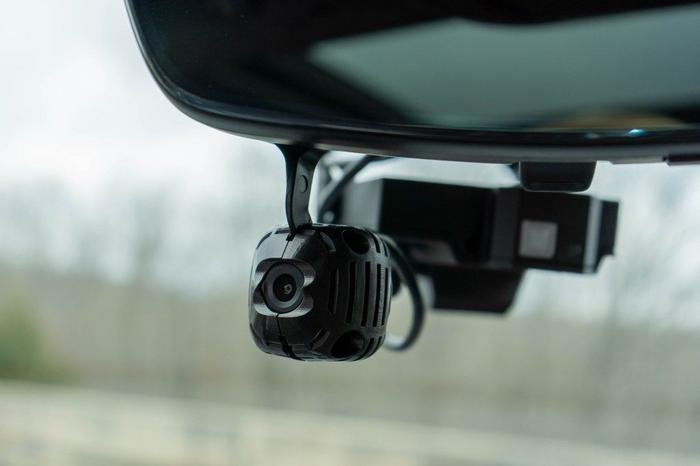 A driver-facing camera on the vehicle’s rearview mirror is part of the Virginia Tech Transportation Institute’s system for collecting driver behavior data in naturalistic driving studies.