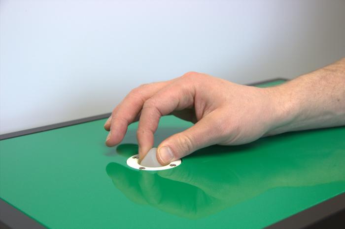 The test rig: pinching a soft surface to prompt a response